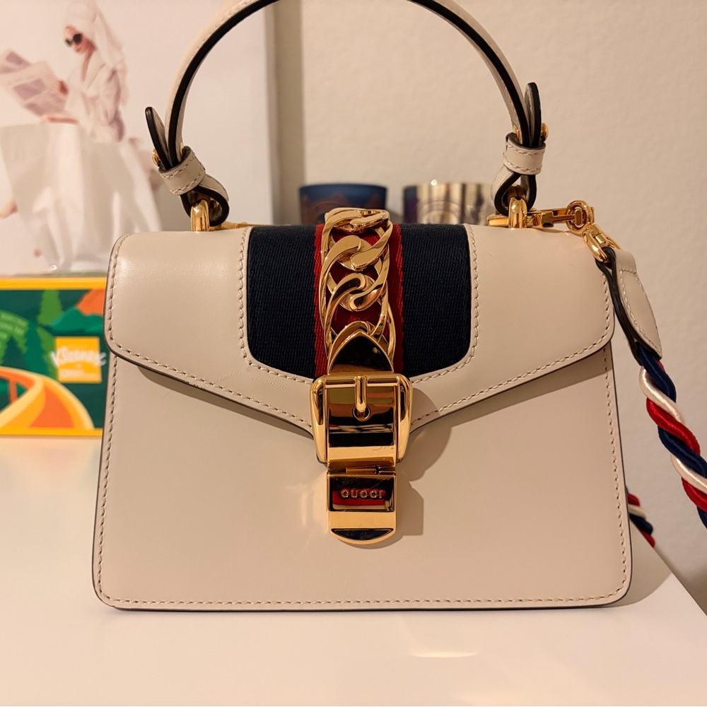 Gucci Sylvie Top Handle Bag in Cream with Gold and Red Accents